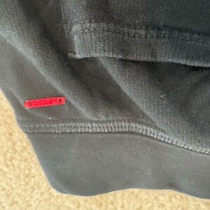 n:PHILANTHROPY Black Garment with Red Tag